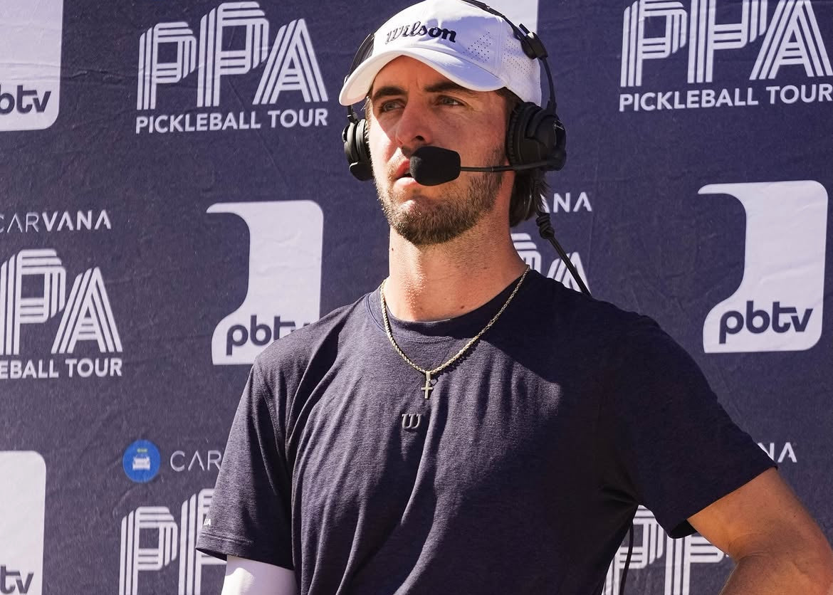 Hunter Johnson with a microphone and water bottle in front of a PPA Pickleball Tour backdrop
