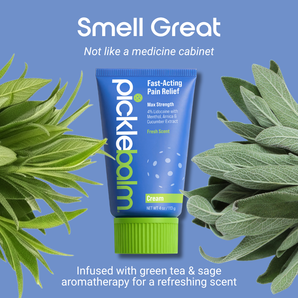 Picklebalm pain relief cream tube with green tea and sage leaves on a blue background