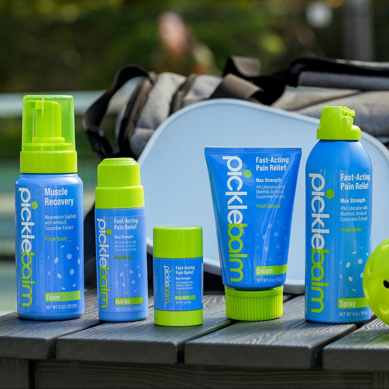 Picklerelief products on a table with a tennis court background